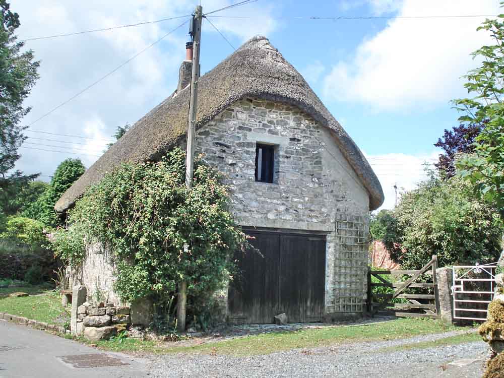 The gable-end of a picturesque thatched cottage