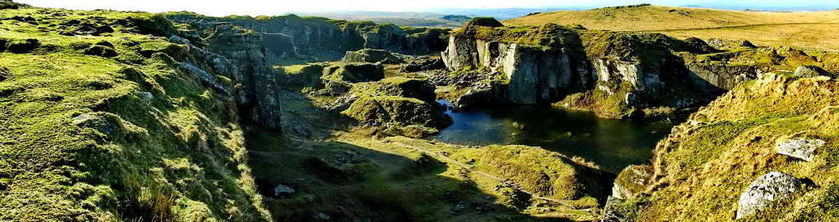 Looking into the quarry from above. The site of a building can be seen in the shadow near the bottom of the picture