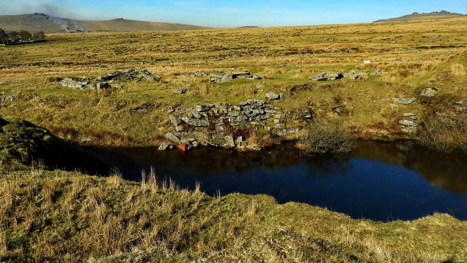 Looking across the entrance to West Mead Quarry at the ruins of its buildings. These included a blacksmith’s shop and a crane platform and possibly a compressor base for air tools