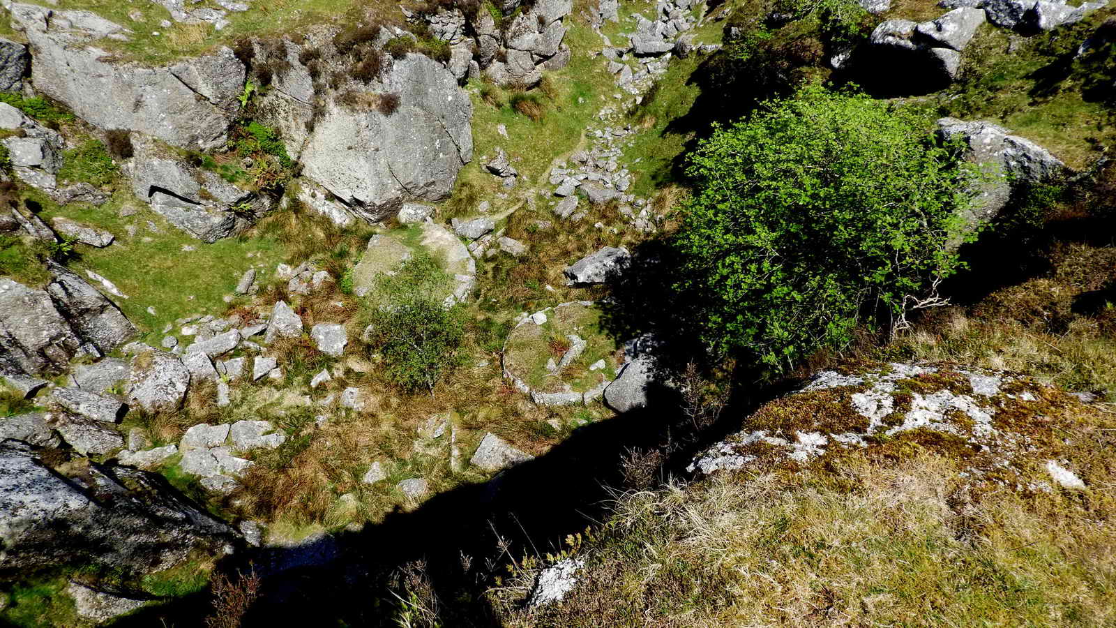 Looking down into the quarry at two old crane bases