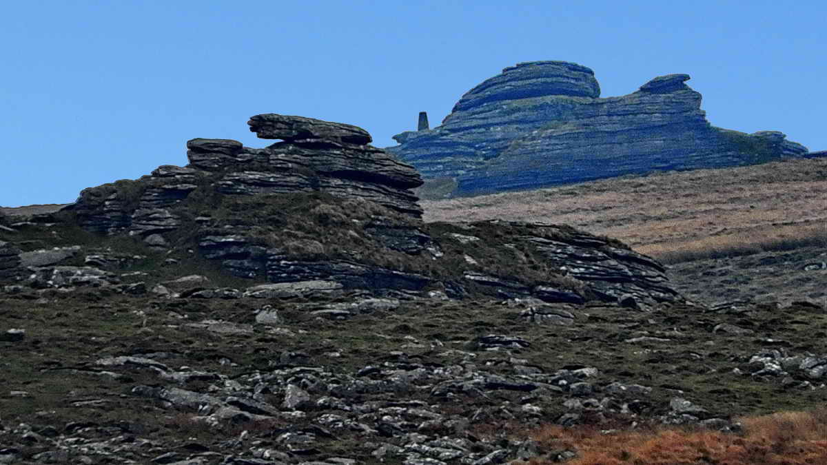 Even more zoomed, showing the Triangulation Pillar on Great Links Tor, 2.43km distant