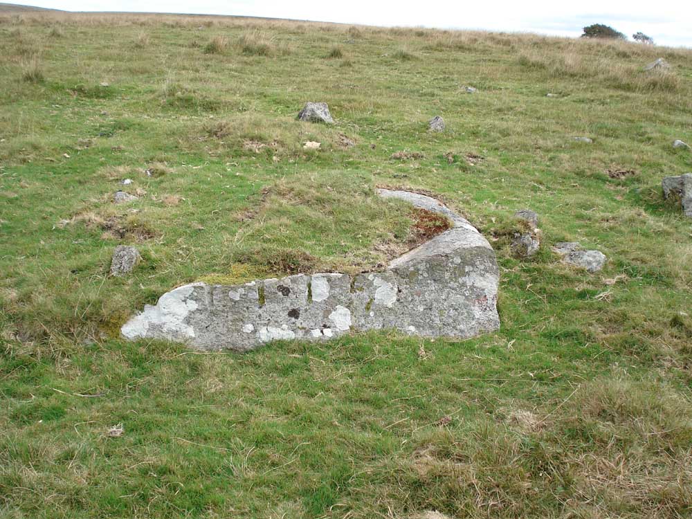 A stone showing where it was drilled and split using tare and feathers