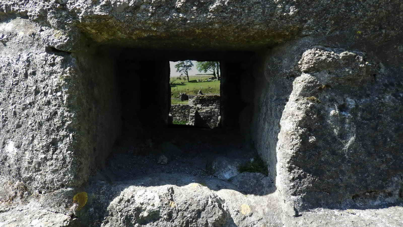 Looking straight through the chimney base; presumably the openings might have been to do with managing draft and pulling smoke or fumes from a fire