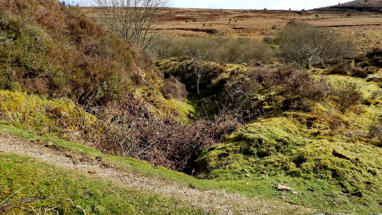 The now empty leat above the wheelpit which once fed it