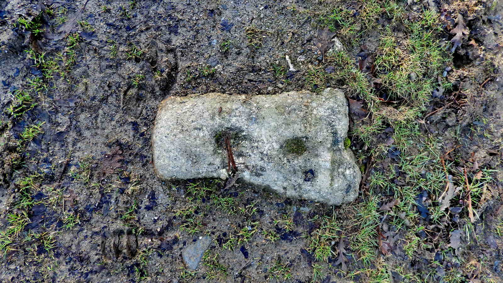 Granite sett with holes for fixing the rails