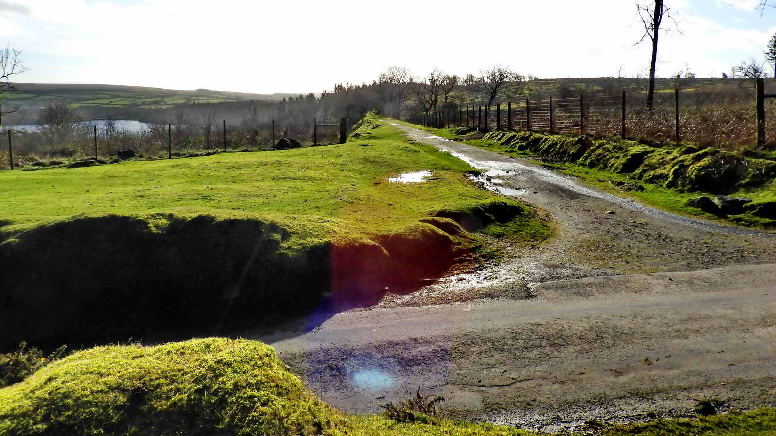 Looking at the crossing keeper’s cottage area, along the steam railway route, across the road that runs from Lowery Cross (right) to Cross Gate (left)